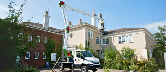 using our cherry picker on a commercial gutter cleaning job in Painswick